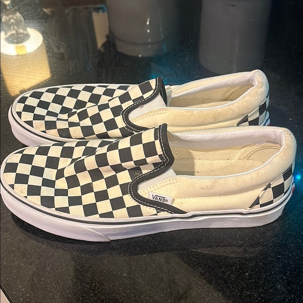 Vans Black and Cream Checkered Slip-On Sneakers